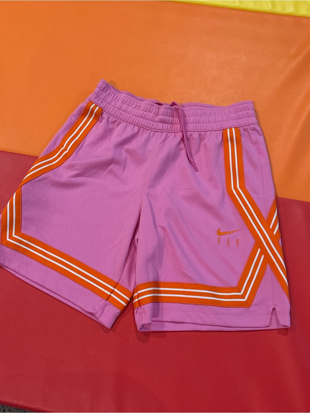 Nike Pink Shorts with Orange Stripe Detail